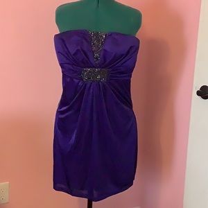 Beaded, strapless deep purple short dress.